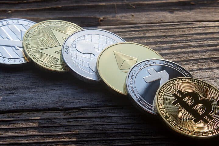 A photo of different cryptocurrency coins.